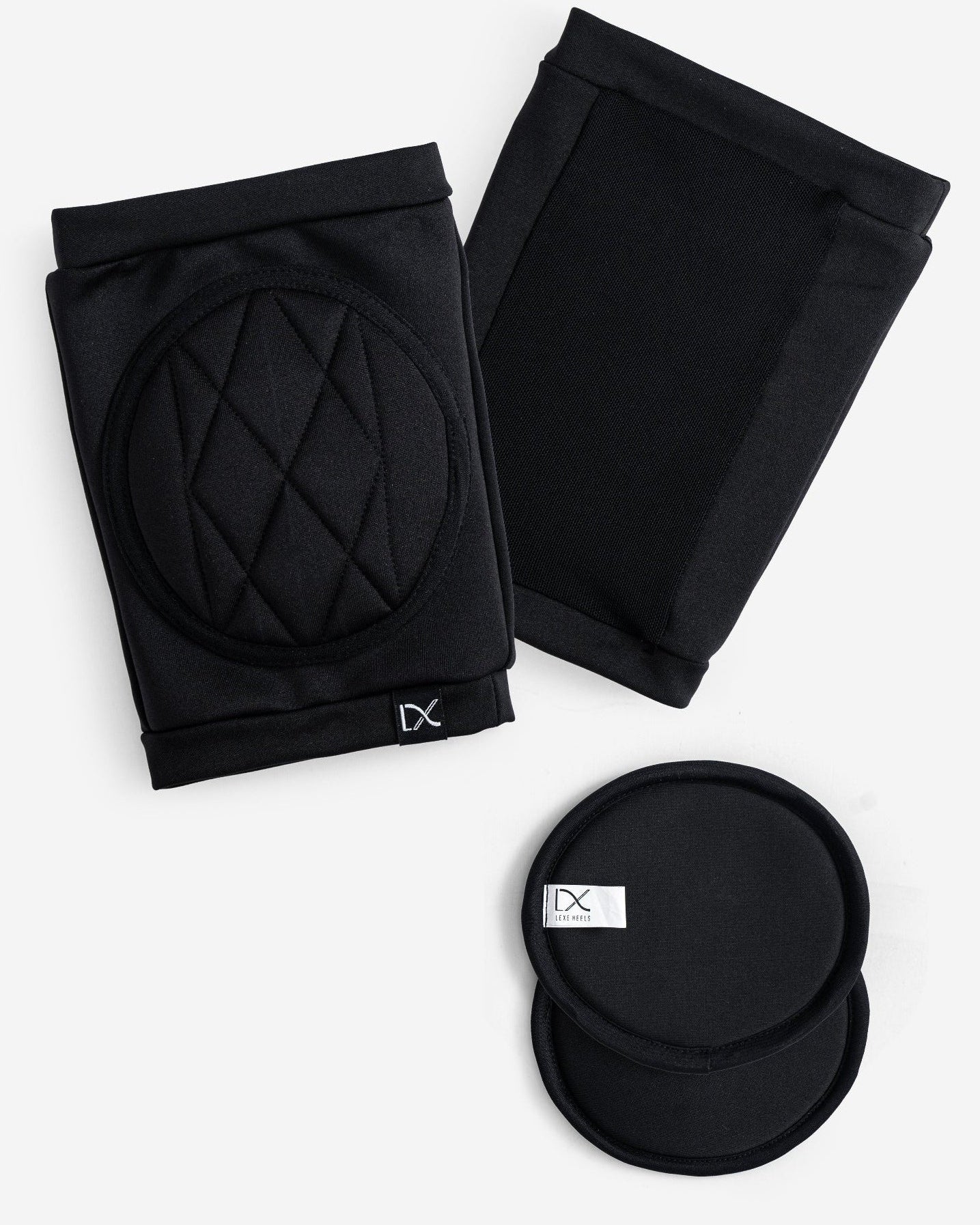 Black knee pads with quilted padded design on a white background