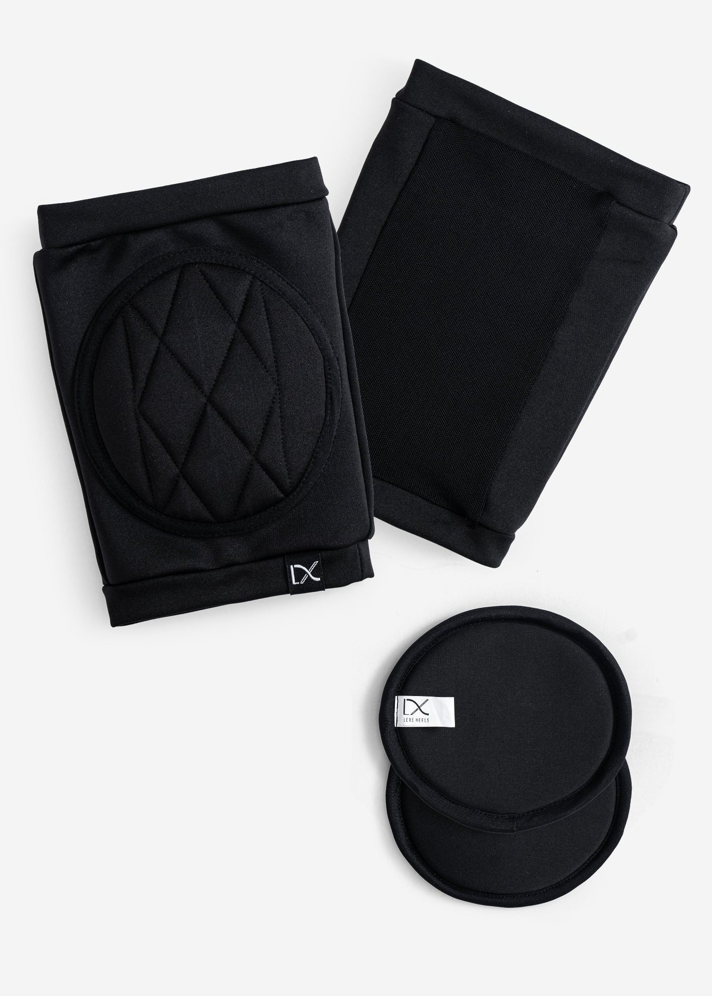 Black knee pads with quilted padded design on a white background